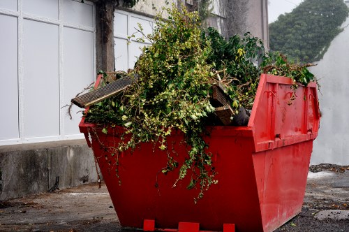 Workers sorting different types of construction waste